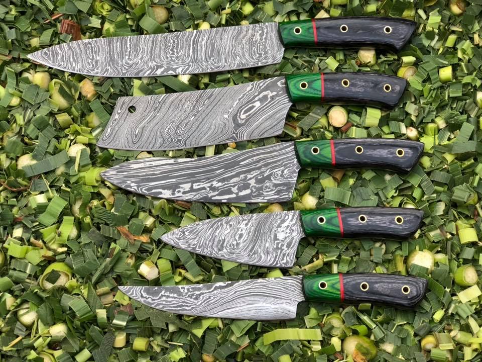5-piece kitchen knives set with Twist Damascus steel blades and handles made from Exotic Color Wood. Perfectly stored in a leather roll for culinary excellence.