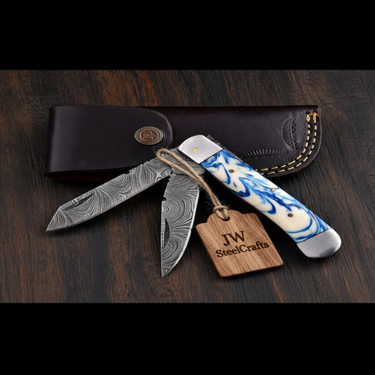 Dual-Blade Folding Trapper Sky Blue Resin Handle Steel Bolster Trapper