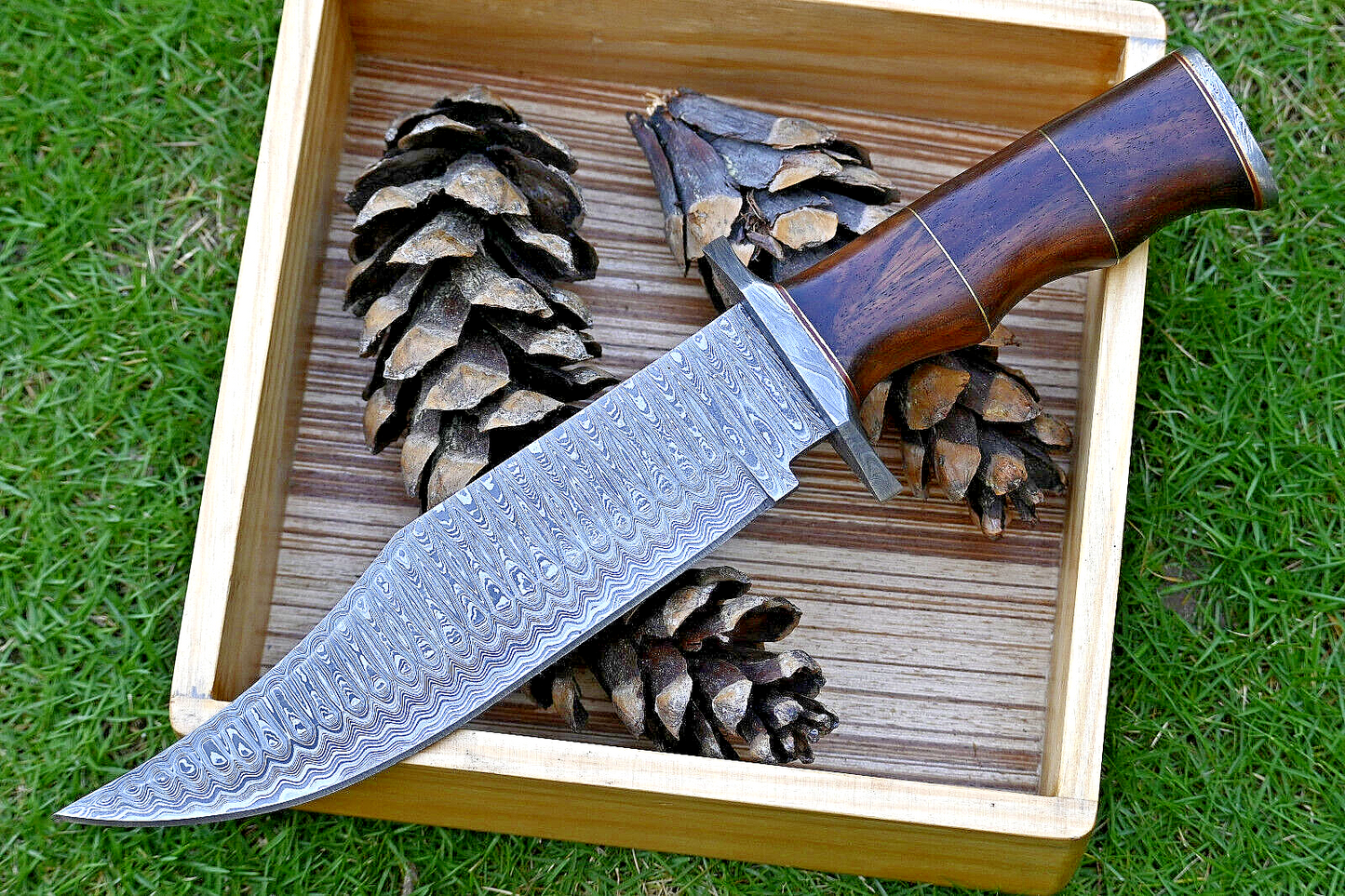 Wilderness Guardian: Hunting Bowie Knife with Damascus Steel Blade, Rosewood Handle, Brass Spacers, Damascus Guard, and Leather Sheath